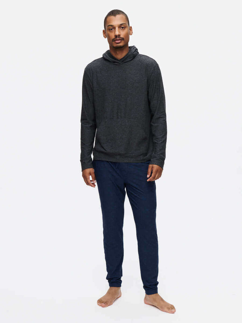 Model wearing CloudKnit Slim Sweatpant with pockets and drawstring waistband in breathable fabric.