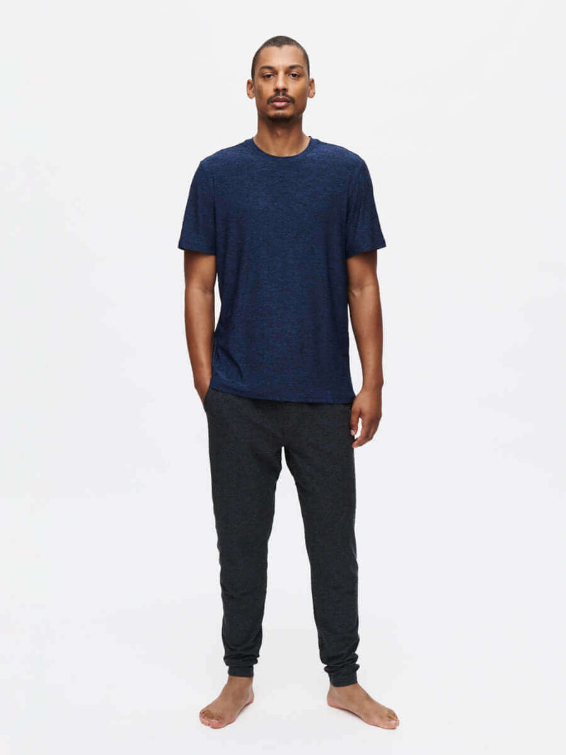 Model wearing CloudKnit Slim Sweatpant with a navy t-shirt, showcasing style and comfort for everyday wear.