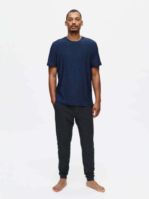 Model wearing CloudKnit Slim Sweatpant with a navy t-shirt, showcasing style and comfort for everyday wear.