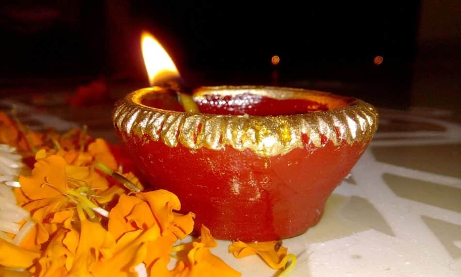 Lighting a lamp (diya)