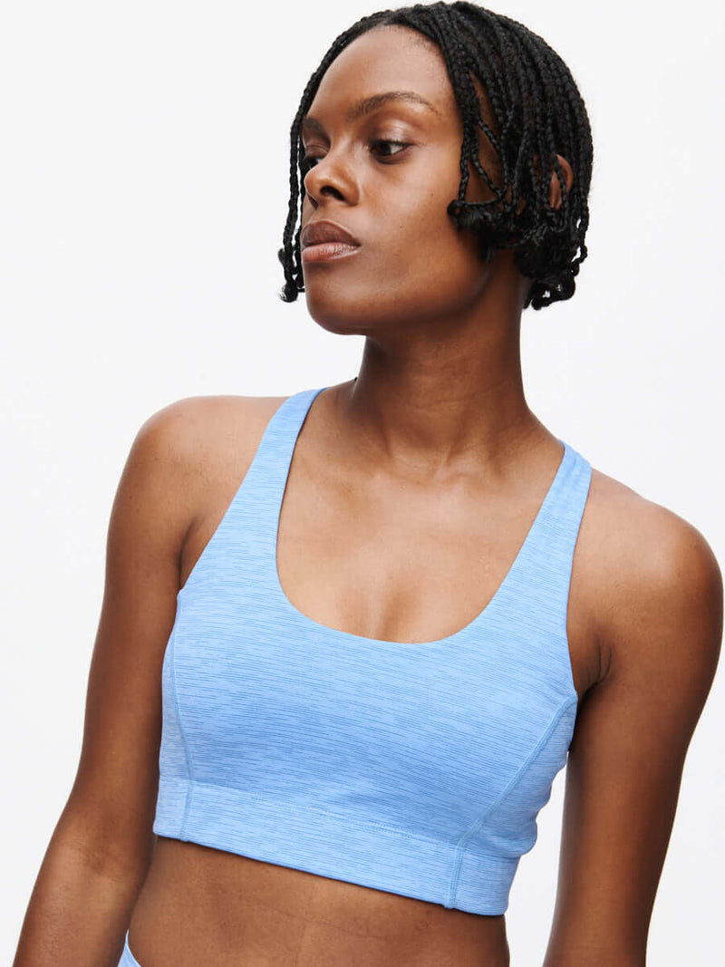 Doing Things Bra CL in a light blue color worn by a model with braided hair.