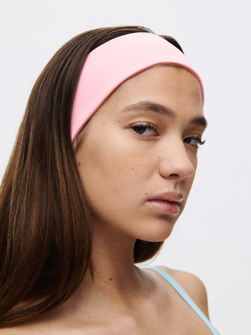 Dolly Headband in soft Bubble Wrap fabric, smooth texture, stylish pink headband for comfortable wear.