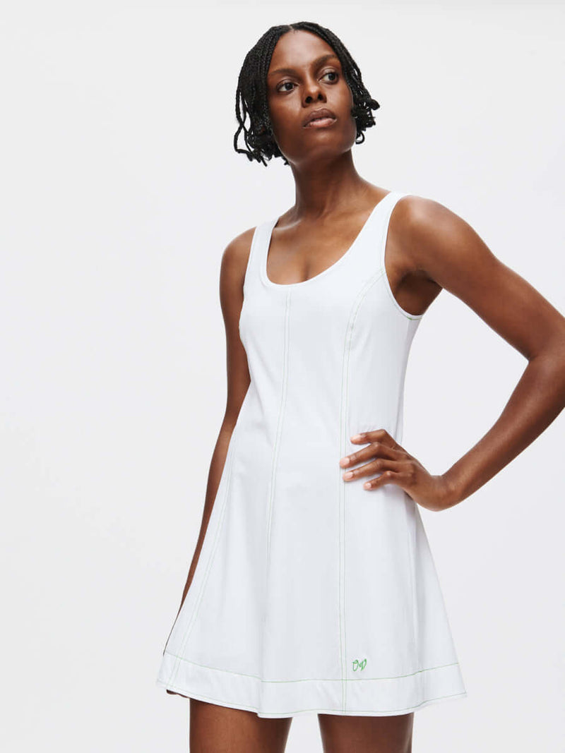 Model showcasing the Energy Dress with built-in shorts and A-line silhouette, perfect for active movement.