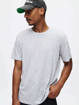 Model wearing Everyday Classic Shortsleeve t-shirt in soft gray organic cotton jersey.