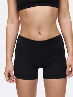 Model wearing Gemini 3" Short in black, showcasing the medium-rise fit and signature silicone gripper band.