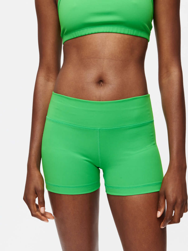 Gemini 3" Short in vibrant green, showcasing medium-rise fit and sleek design with silicone gripper band.