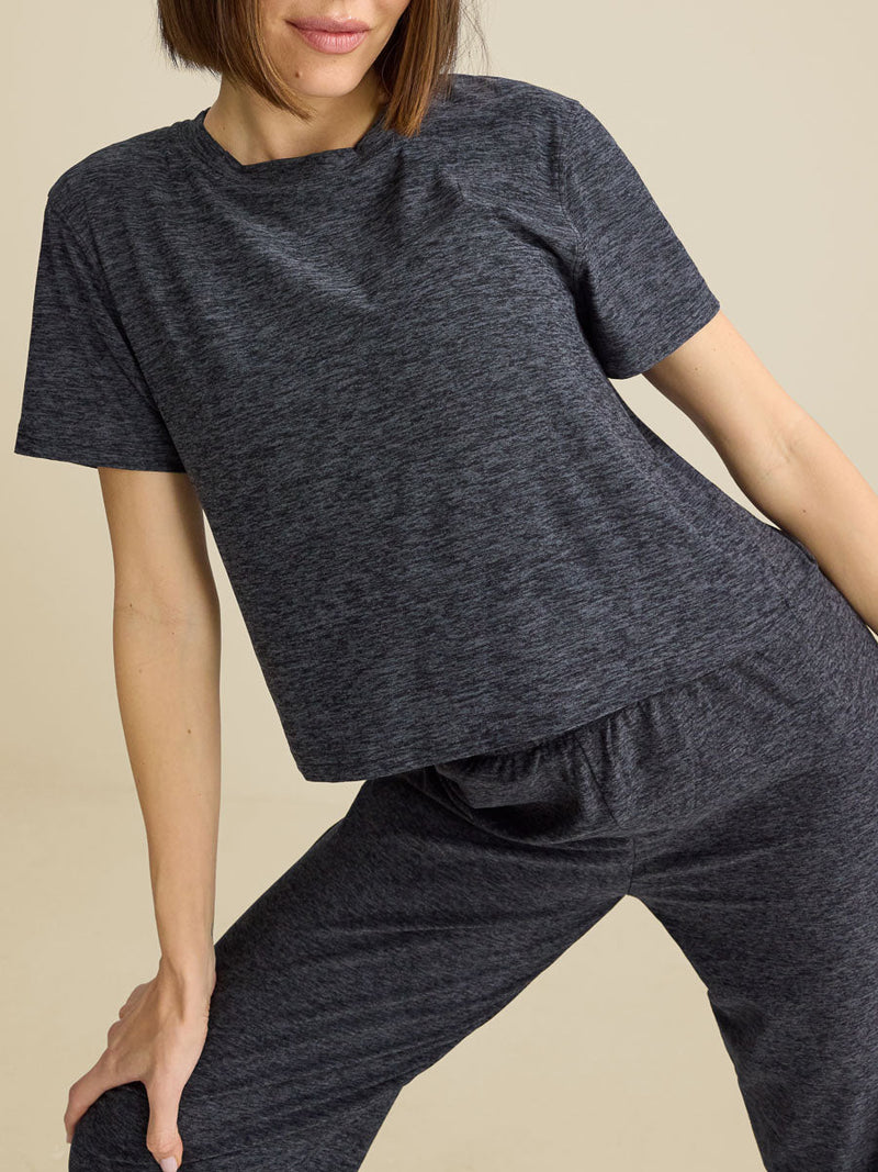 a person wearing a dark grey shirt