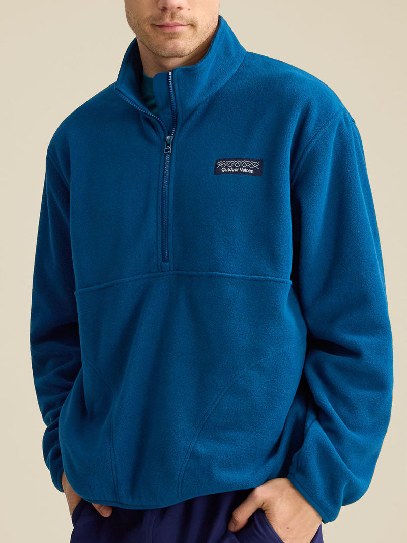 a person wearing a blue sweater