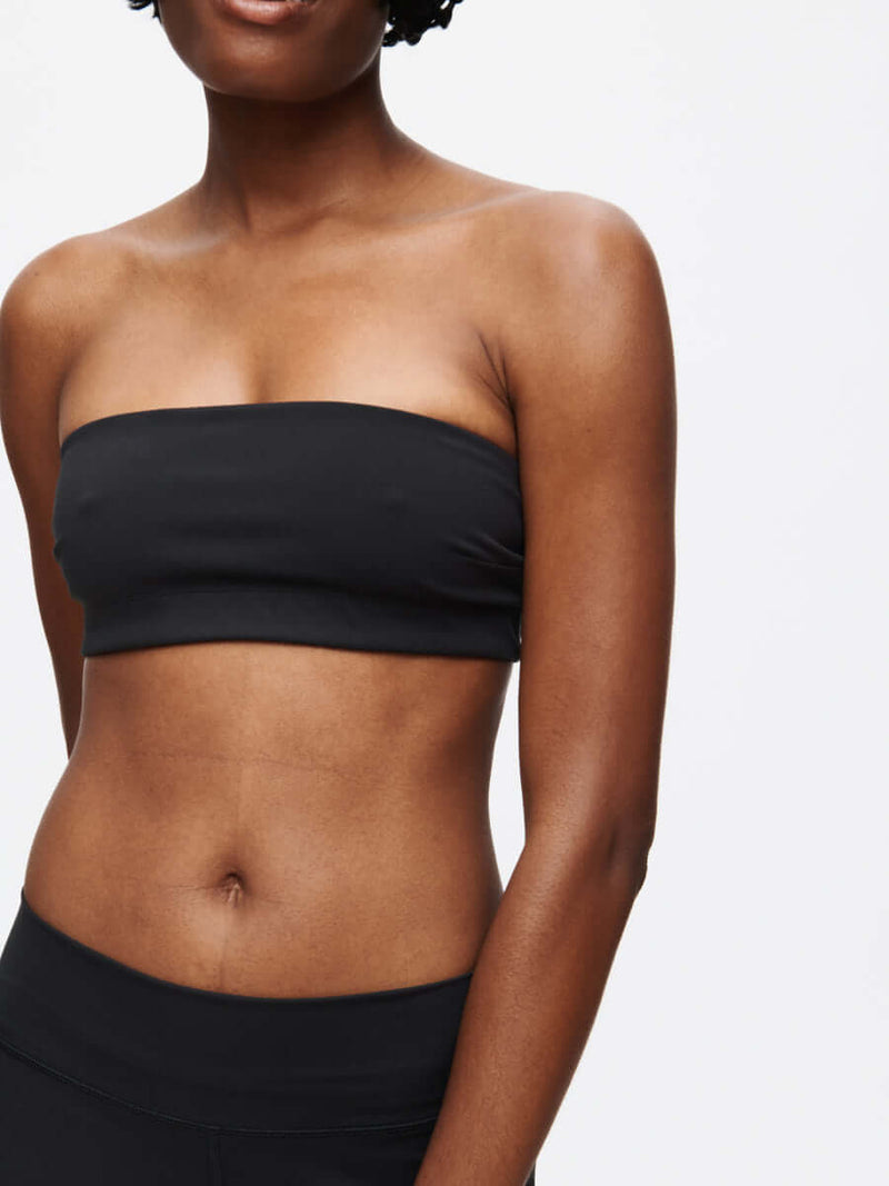 Love Bra in sleek black, a stylish bandeau top designed for comfort and movement with a silicone gripper band.