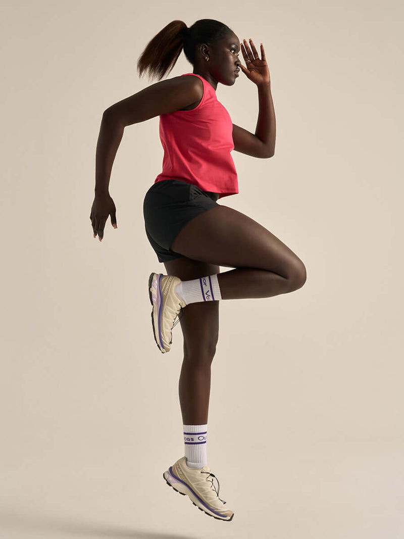 Athlete wearing the ThinkFast Mesh Cropped Muscle Tank CL in action during a workout.