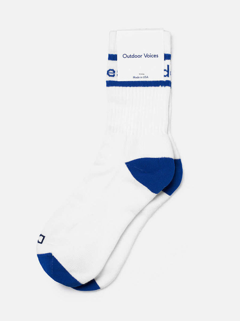 OV Club Crew Sock in white and blue with sweat-wicking fabric and printed 'Doing Things' to distinguish sides.