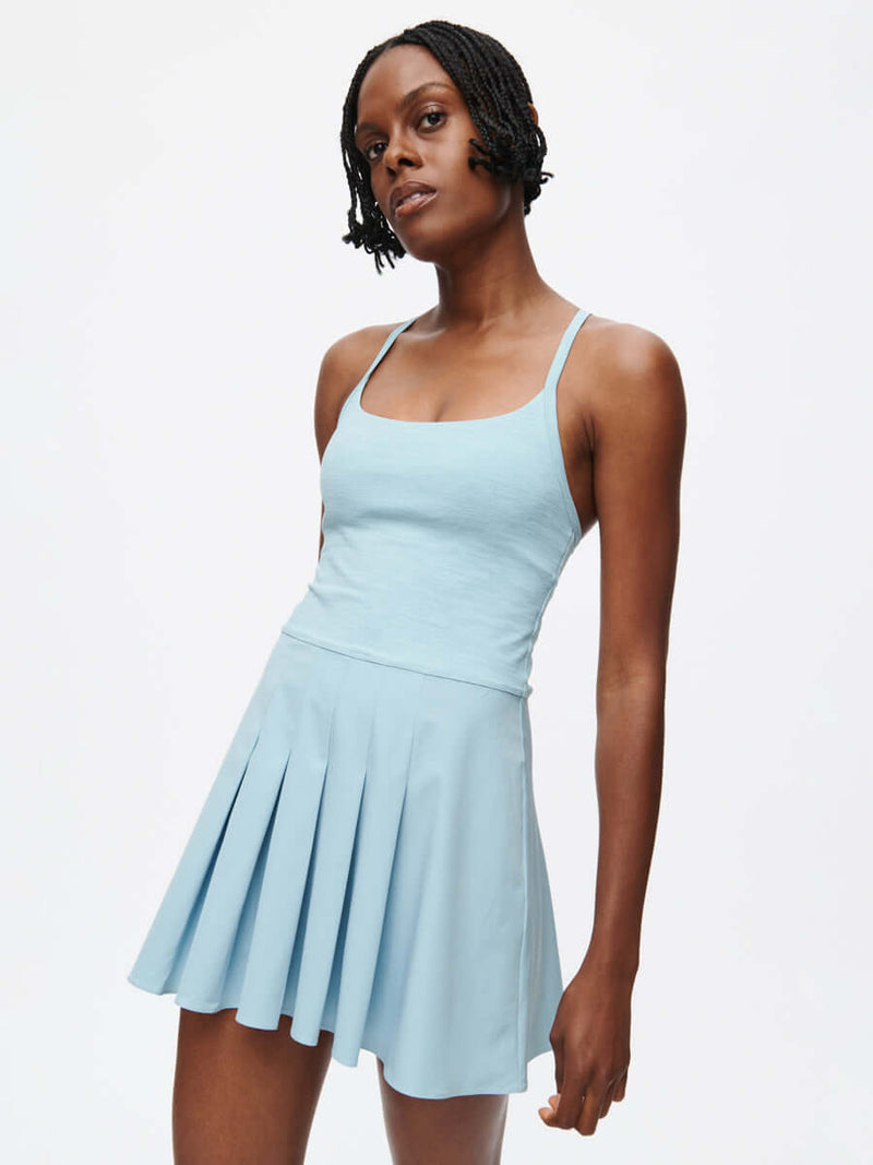 Sporty Dress in light blue with adjustable straps and pleated skirt, perfect for active outings.