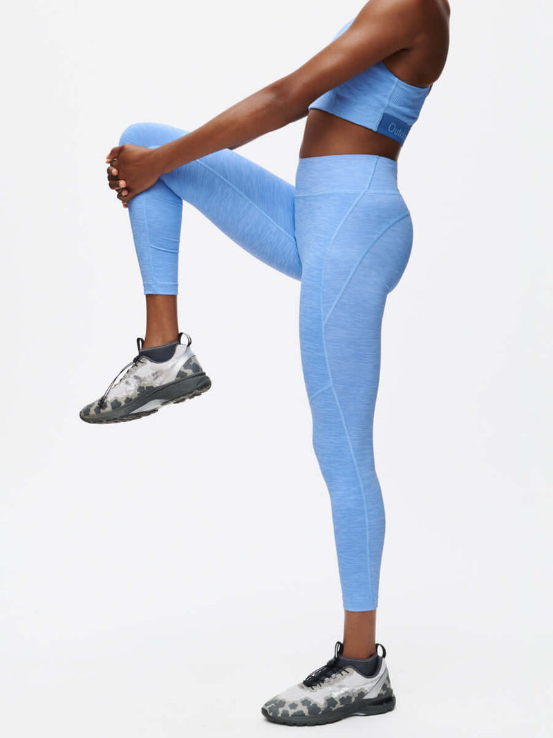 Model wearing TechSweat Core 7/8 Legging CL in blue during workout, showcasing stylish gym attire.