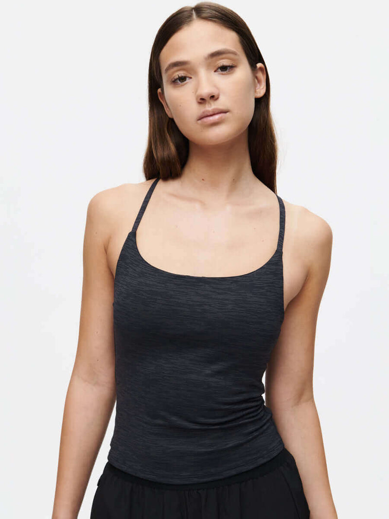 TechSweat Move Free Tank in black with adjustable racerback straps and built-in shelf bra for high performance.