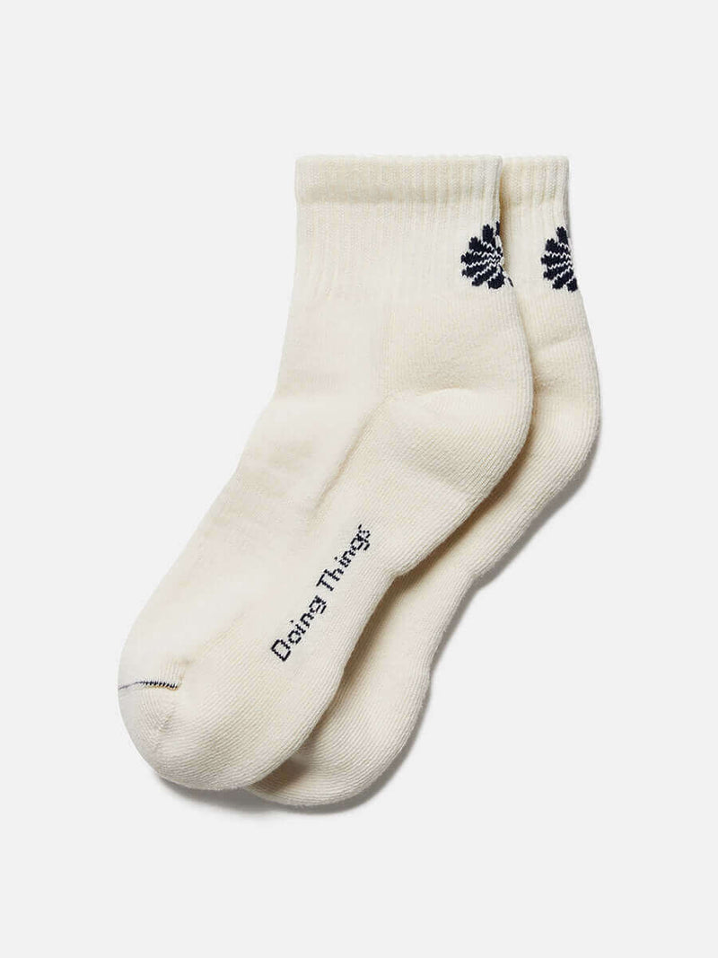 OV Graphic Rec Ankle Sock CL in cream color with unique design and playful branding on the side.