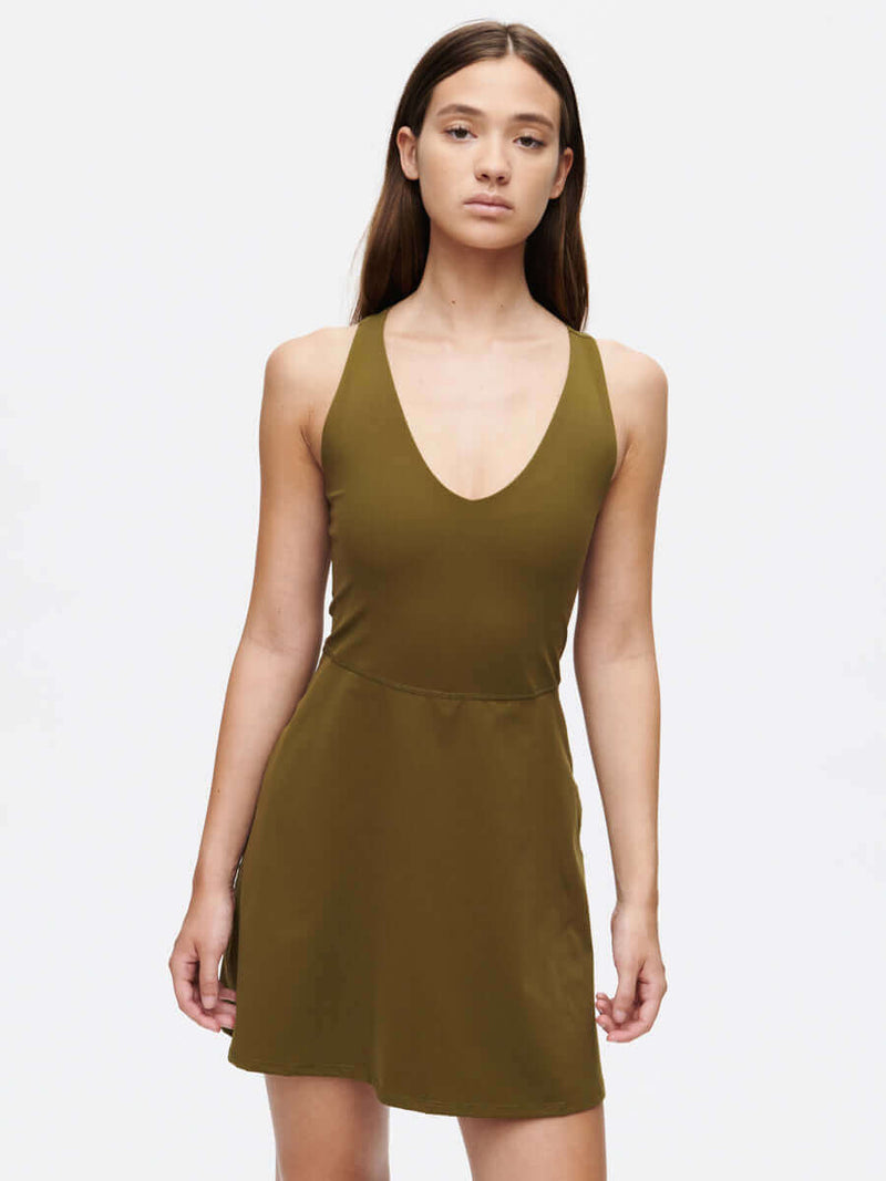 Volley Dress in olive green with a V-neck and fit-and-flare silhouette, perfect for active wear.
