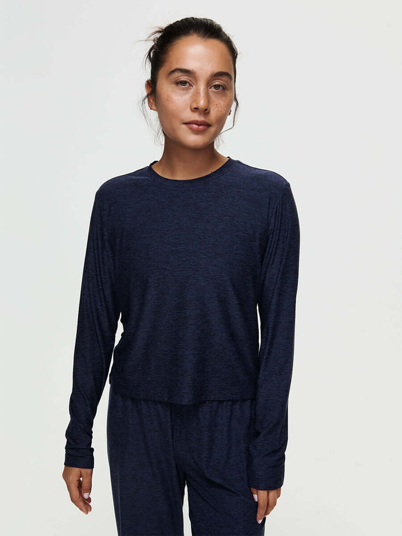 Model wearing the CloudKnit Boxy Longsleeve in navy, showcasing its breathable and cropped design.