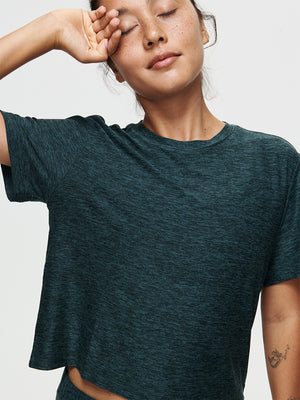 Model wearing the CloudKnit Boxy Shortsleeve shirt, showcasing comfort and style in breathable fabric.