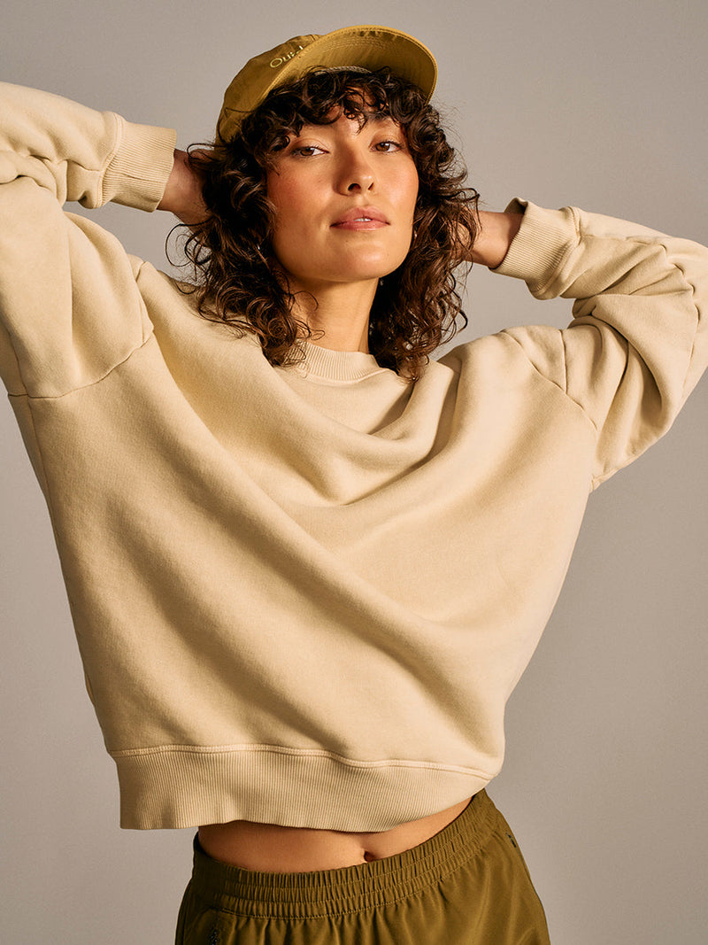 a person wearing light tan sweater