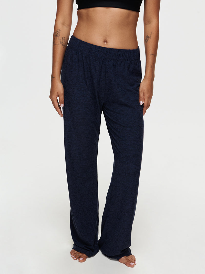 Model wearing CloudKnit Wide Leg Pant in navy, showcasing its comfortable and lightweight design.