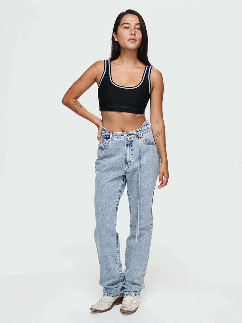 Model wearing Cowgirl Jean with a removable lasso belt, showcasing a stylish mid-rise bootcut design.