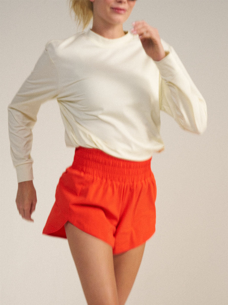 a person wearing red shorts