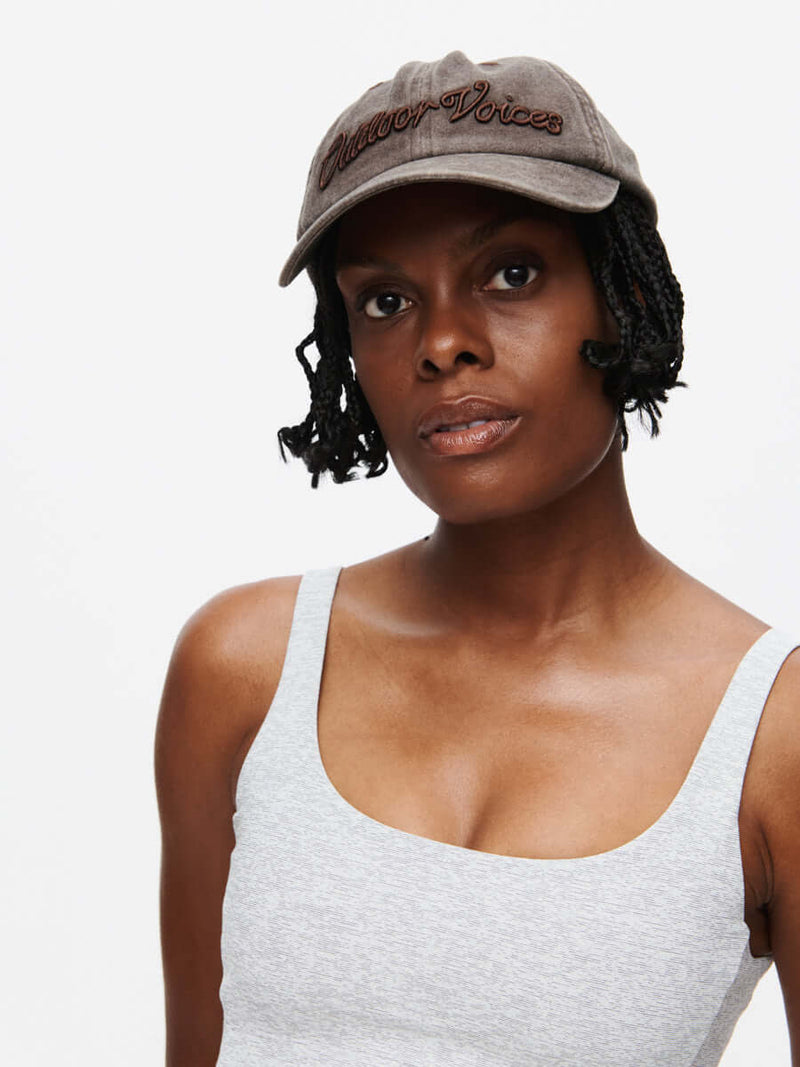 Model wearing a stylish Washed Hat CL with embroidered details, perfect for a trendy look.