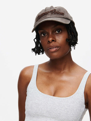 Model wearing a stylish Washed Hat CL with embroidered details, perfect for a trendy look.